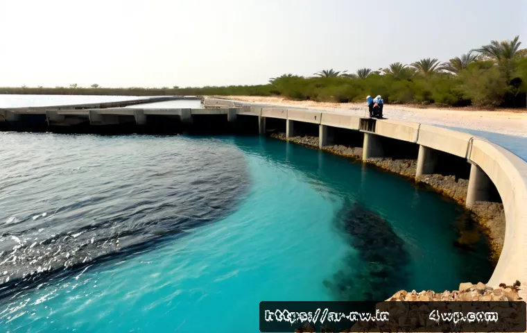 담수화 기술의 환경적 영향 - Photorealistic wide coastal scene in a Gulf-region setting, modern desalination plant beside turquoi...